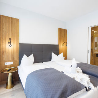 The bedroom and bathroom are separated by a door.