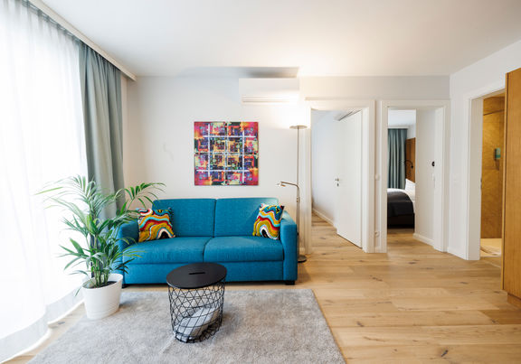 The living room in the Apartment with sofa, table, plant and much more.