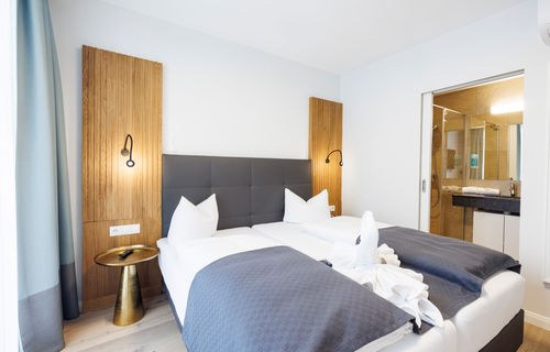 The bedroom and bathroom are separated by a door.
