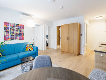 The modern, fully equipped kitchen-living room in the Deluxe Plus Apartment