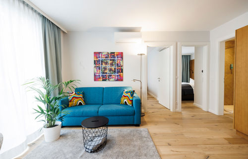 The living room in the Apartment with sofa, table, plant and much more.