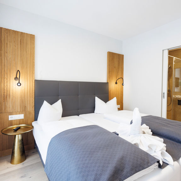 The bedroom and bathroom are separated by a door.