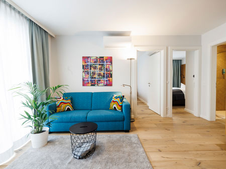 The living room in the Apartment with sofa, table, plant and much more.