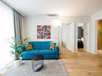 The living room in the Apartment with sofa, table, plant and much more.