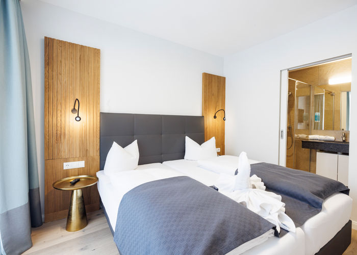 The bedroom and bathroom are separated by a door.
